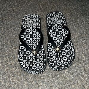Tory Burch flip flops. 6